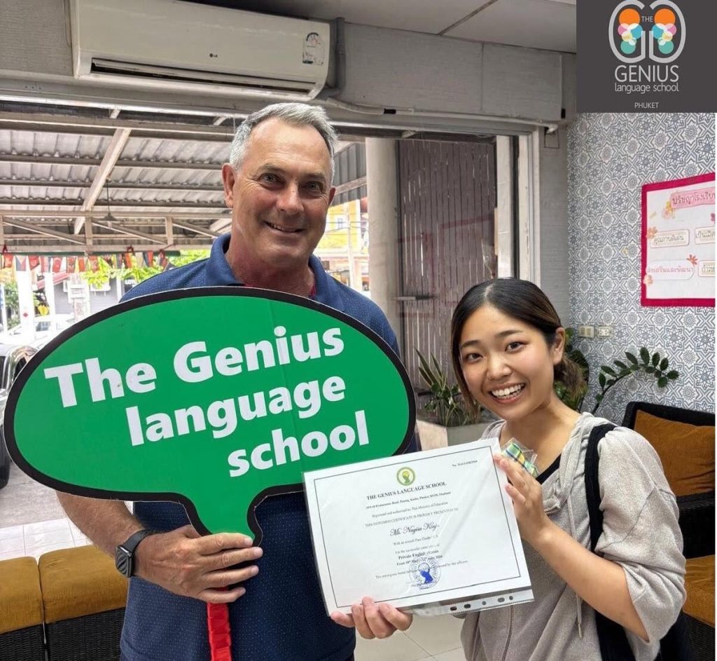 The Genius Language School - August - A student with her certificate posing with a head or teacher